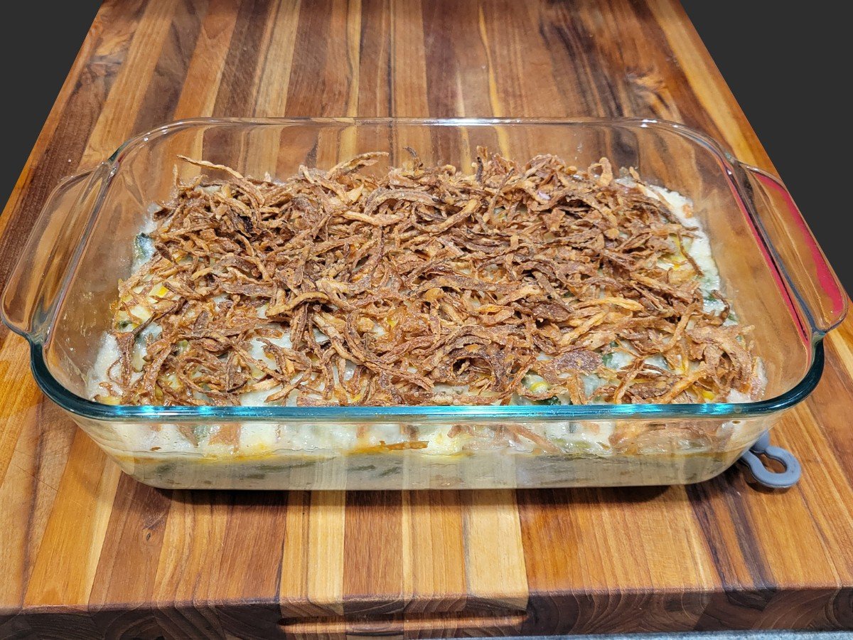 WPRecipe Maker image for homemade green bean casserole with title text and a photo of the casserole topped with crispy fried onions.