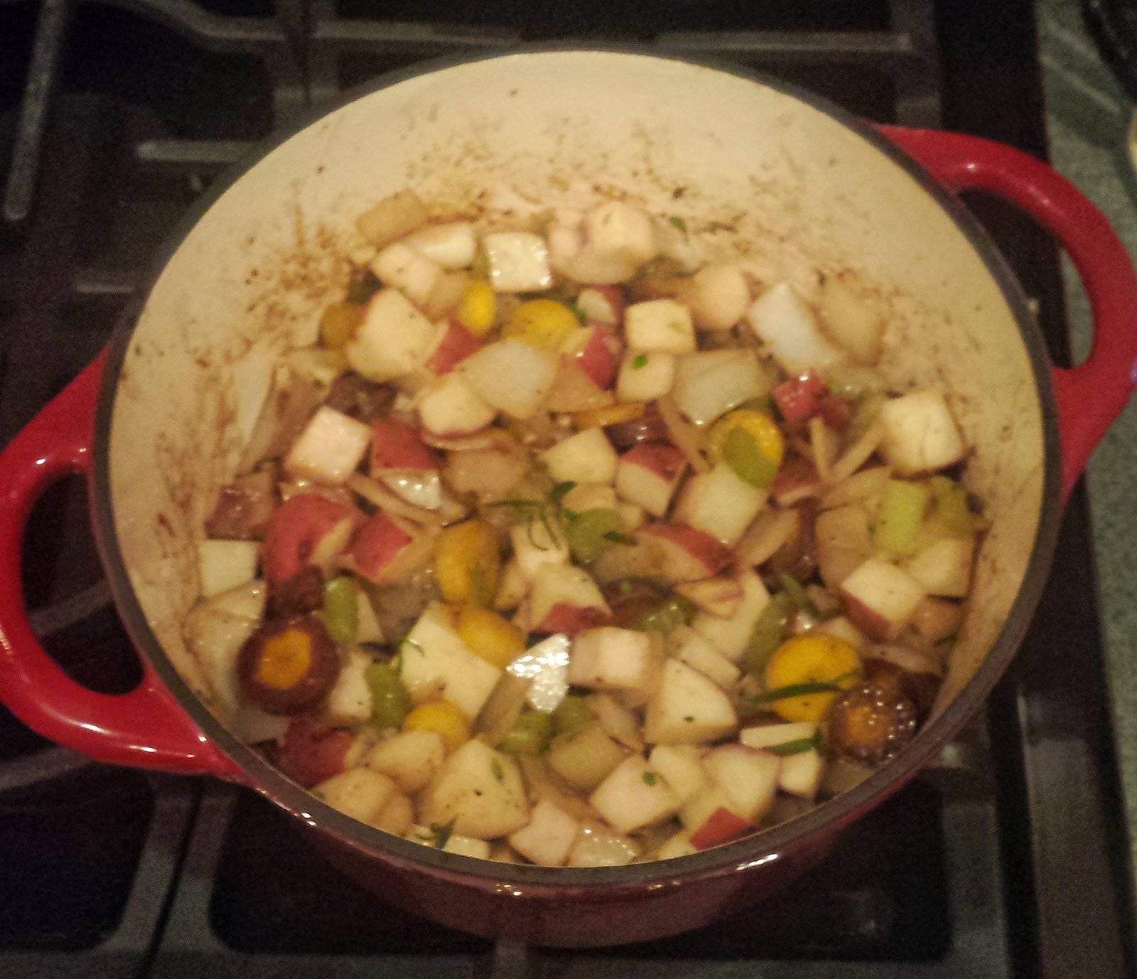 All the vegetables and spices added to the dutch oven.