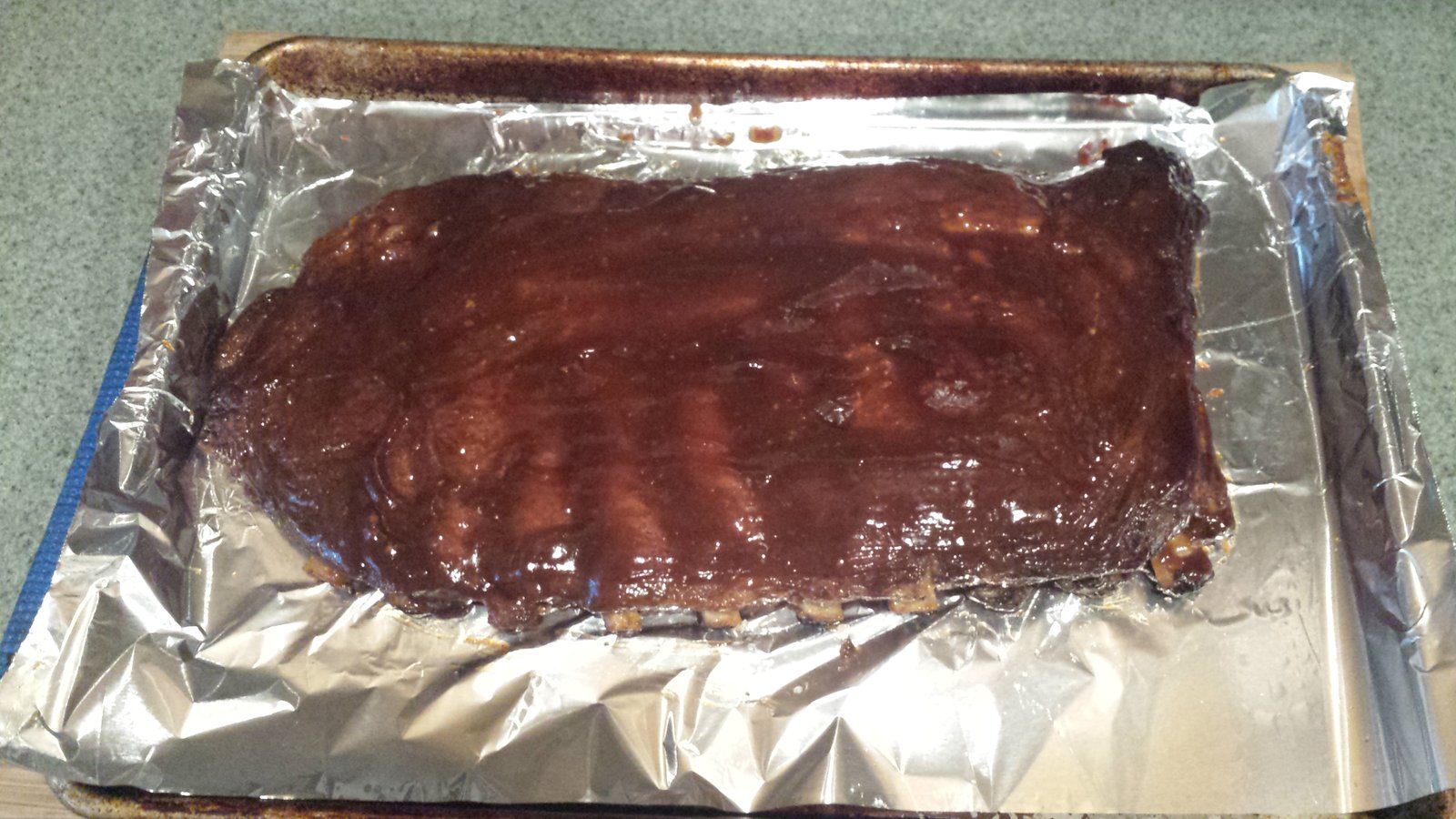 This is the top side of the ribs after we added the BBQ sauce.