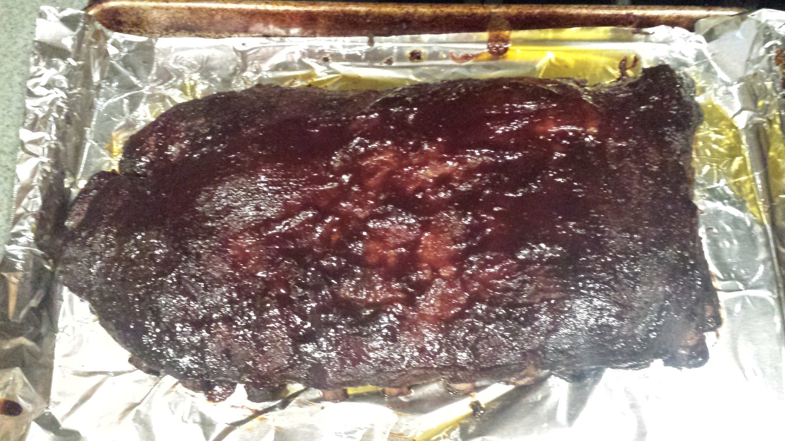 Here are our ribs after an hour in the oven with BBQ sauce on them.