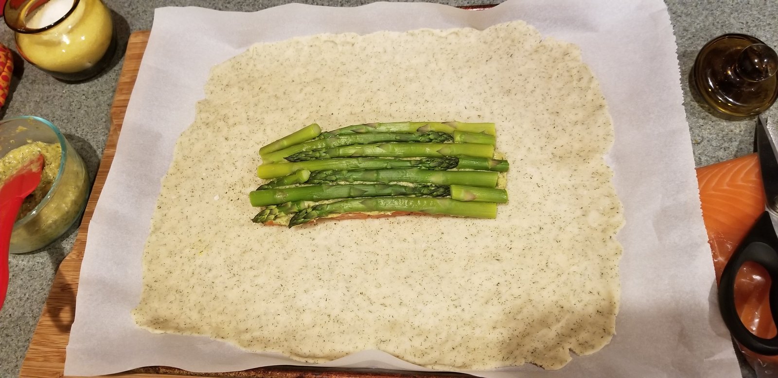 Asparagus spears on top of the cream sauce.