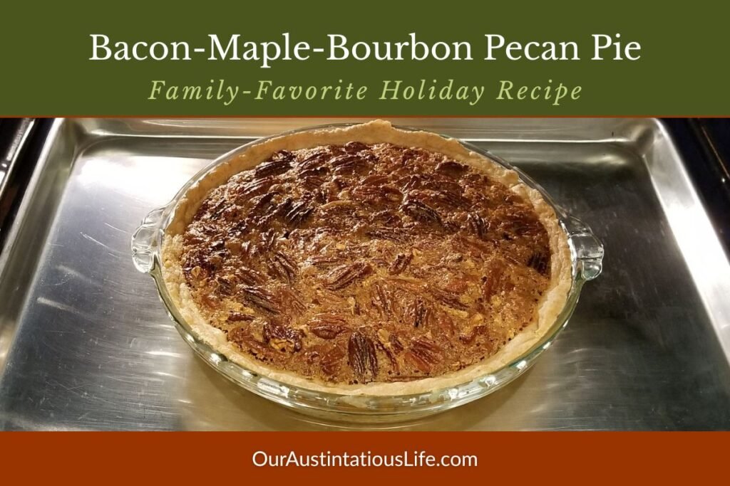 Freshly baked Bacon-Maple-Bourbon Pecan Pie in a glass pie dish, topped with toasted pecans. Holiday dessert recipe.