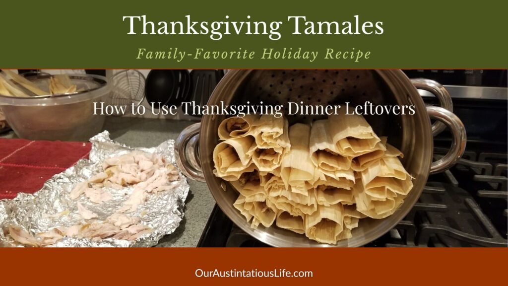 Tamales arranged upright in a large steamer pot before cooking.