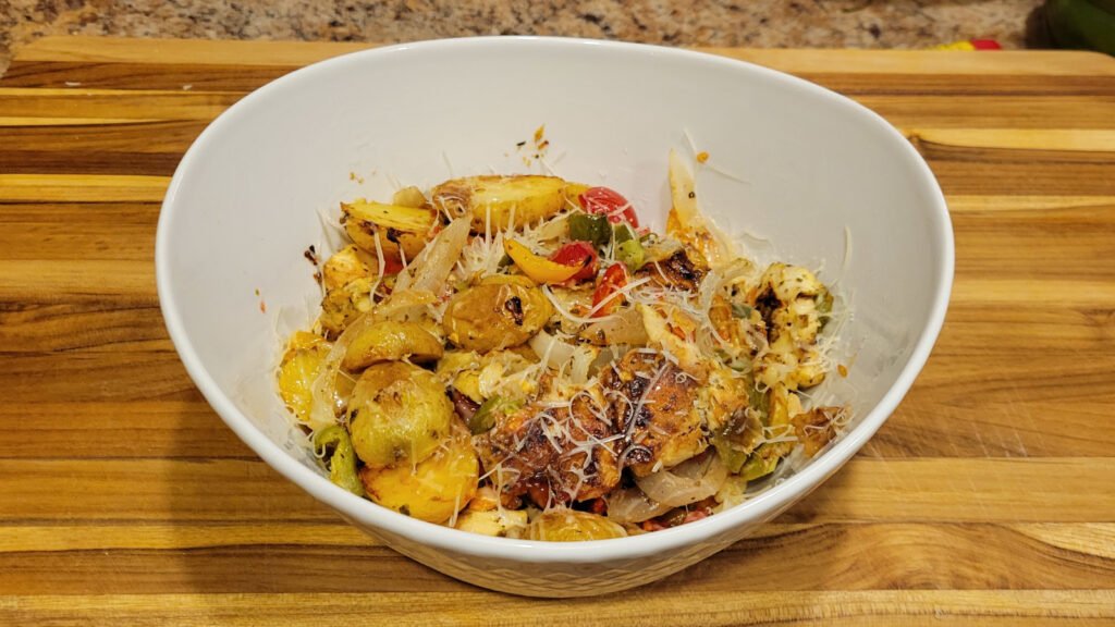 A picture of a bowl of Spicy Italian Chicken and Potatoes ready to eat.