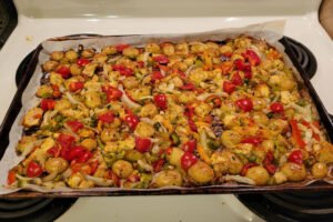 The Spicy Italian Chicken & Pototoes after it has been cooked while still on the baking sheet.