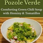 Bowl of Chicken Pozole Verde topped with fresh cilantro, avocado, and radish slices on a wooden cutting board, with green title banner reading “Chicken Pozole Verde – Comforting Green Chili Soup with Hominy & Tomatillos.”