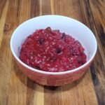Bowl of homemade Tex-Mex cranberry sauce made with fresh cranberries, jalapeño, and lime.