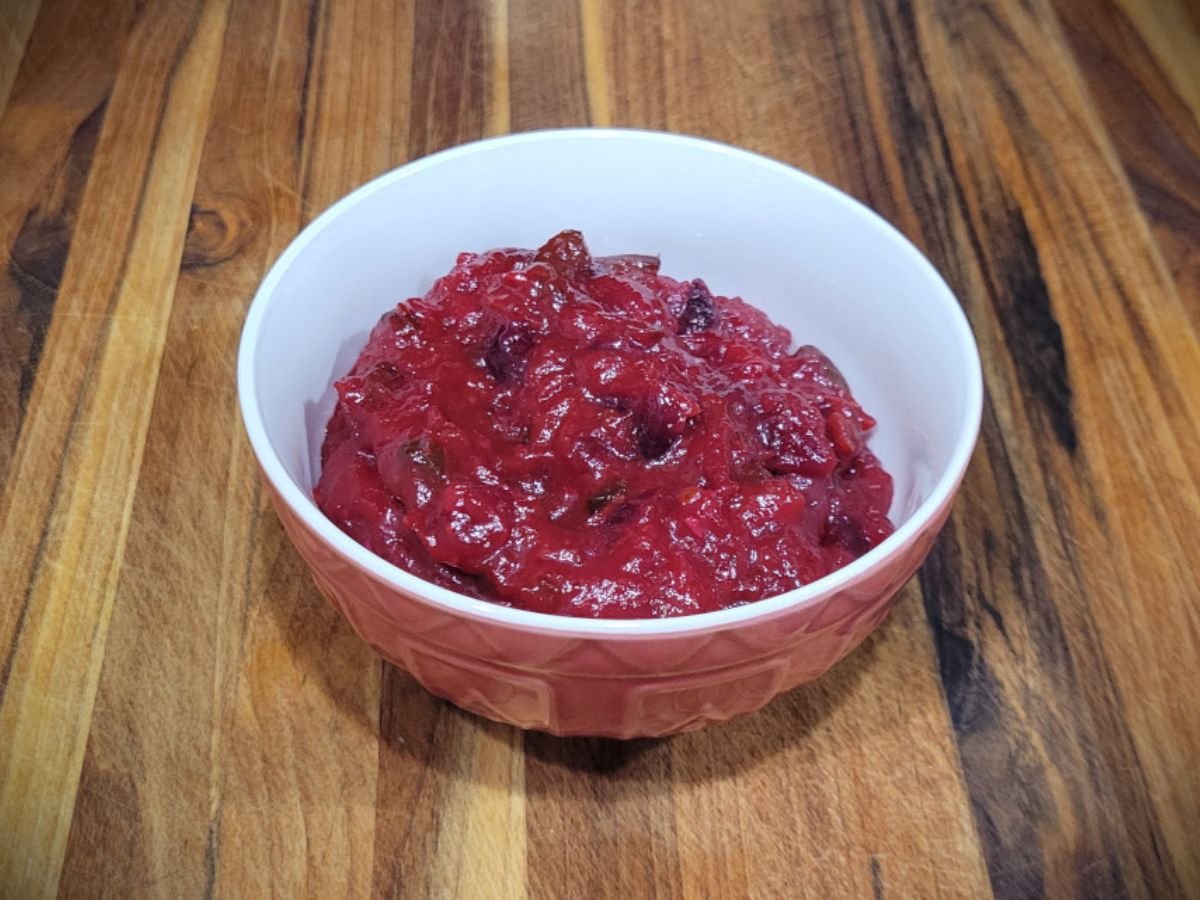 Bowl of homemade Tex-Mex cranberry sauce made with fresh cranberries, jalapeño, and lime.