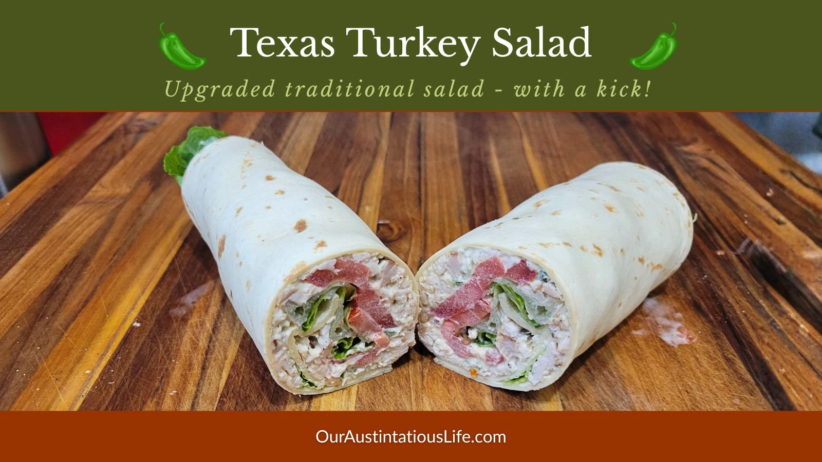 Sliced turkey salad wrap filled with creamy jalapeño turkey salad, tomatoes, and lettuce on a wooden cutting board.